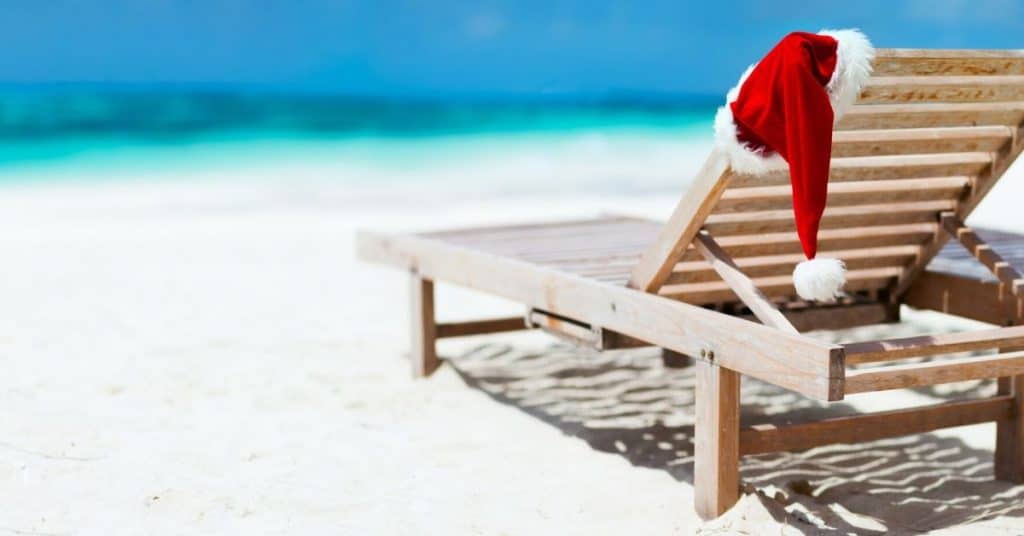 Beach with Santa's Hat on Deck Chair - Christmas in July