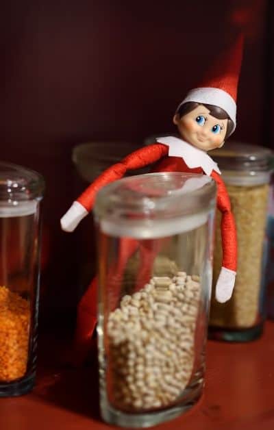 Elf on the shelf in cupboard
