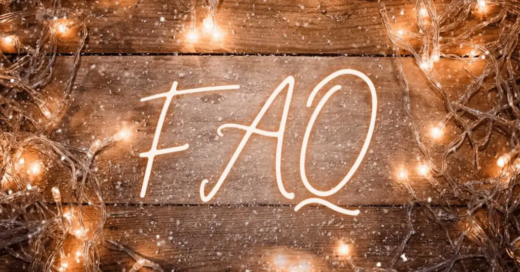 The Word FAQ on a wooden background with LED Lights Around - Open for Christmas