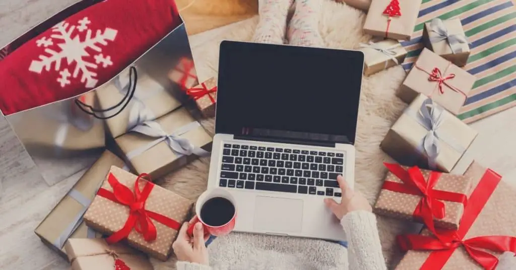A woman doing her Christmas shopping online - tips on how to shop this holiday - Open for Christmas